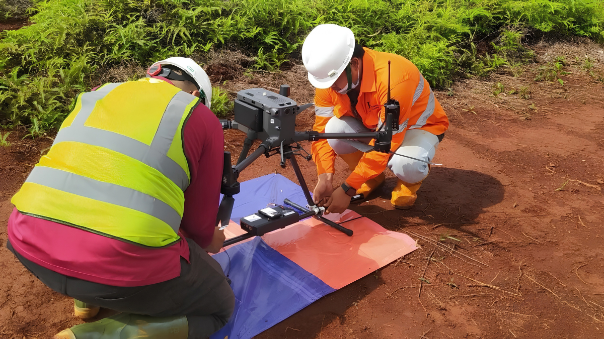 Drone Magnetic Survey UAV equipped with a suspended magnetometer collecting high-resolution magnetic data above a mineral exploration site for precise geological mapping