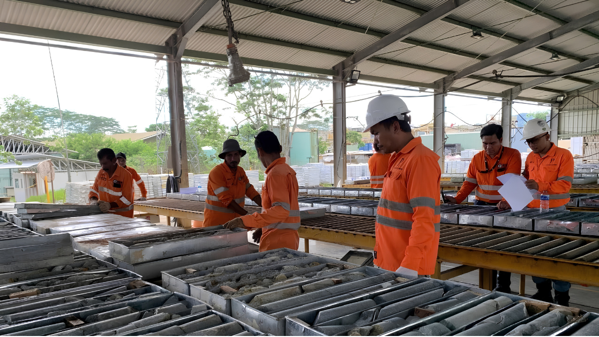 Exploration drilling process showing diamond core drilling operations, core logging, and geological sample analysis during a mineral exploration project in Indonesia